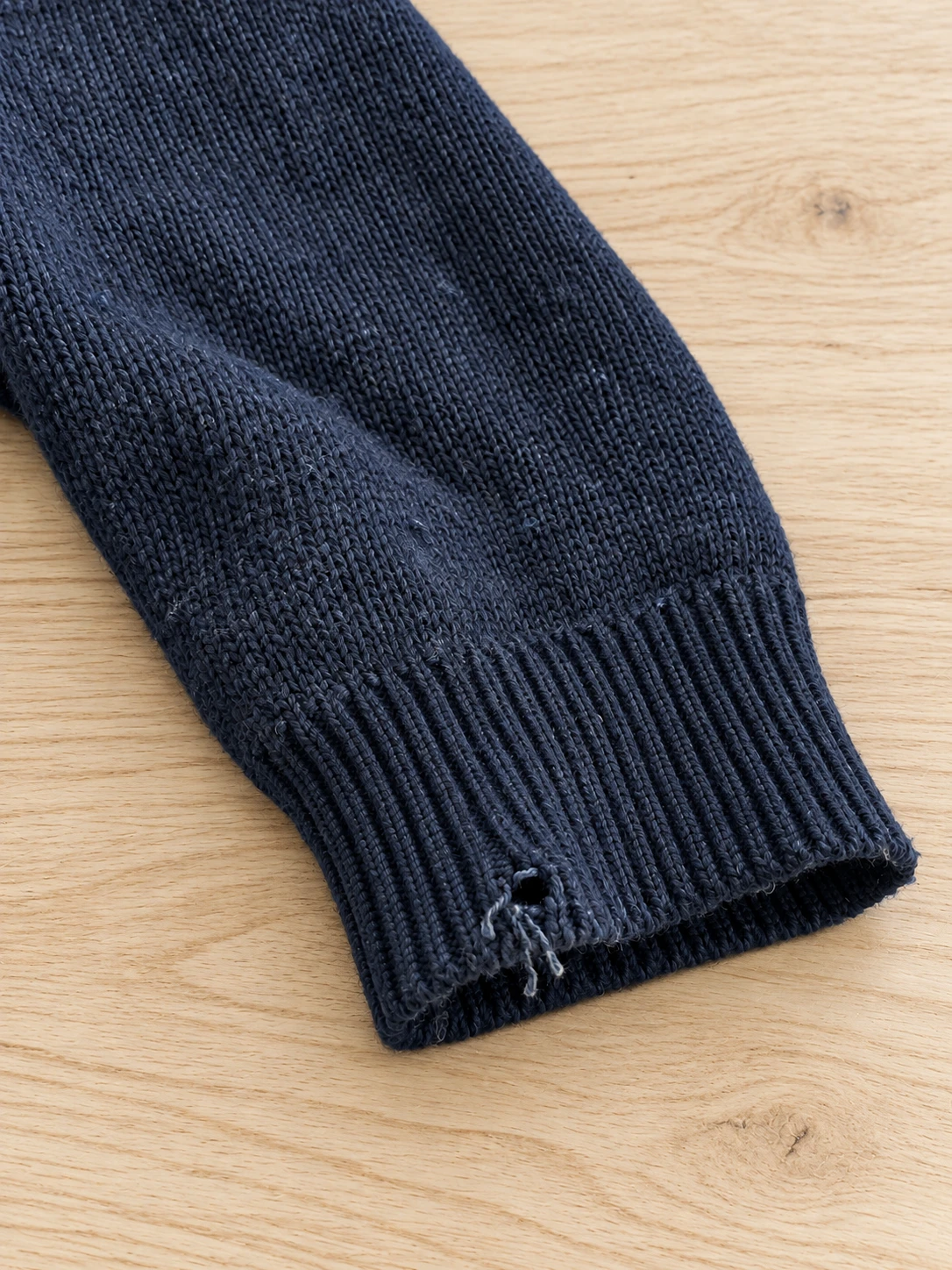 Edited knit cuff with visible wear
